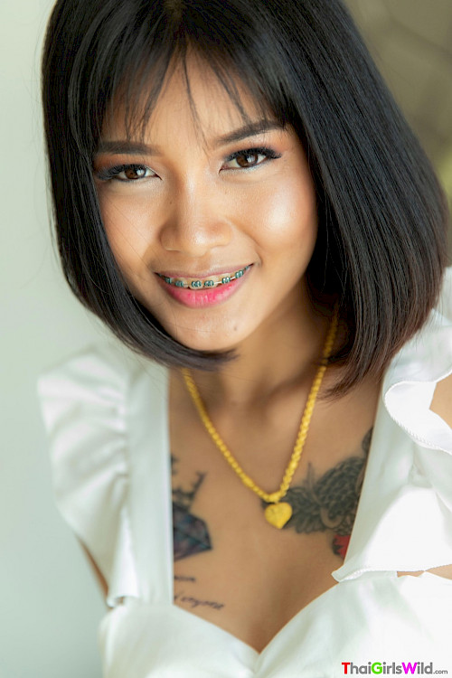 asian teen smiling with braces